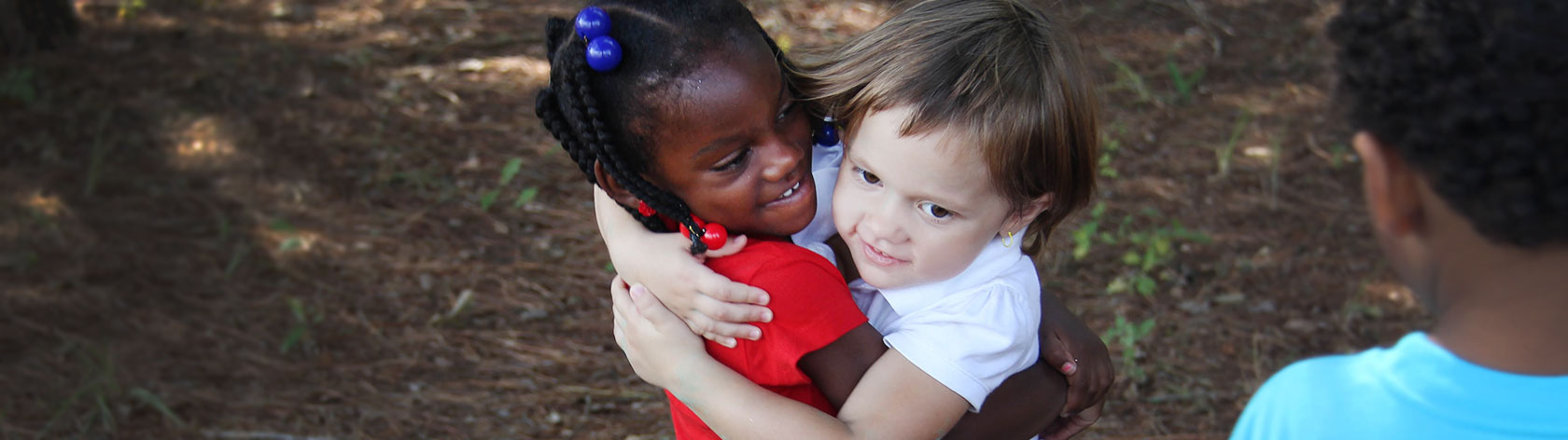 Two children hugging