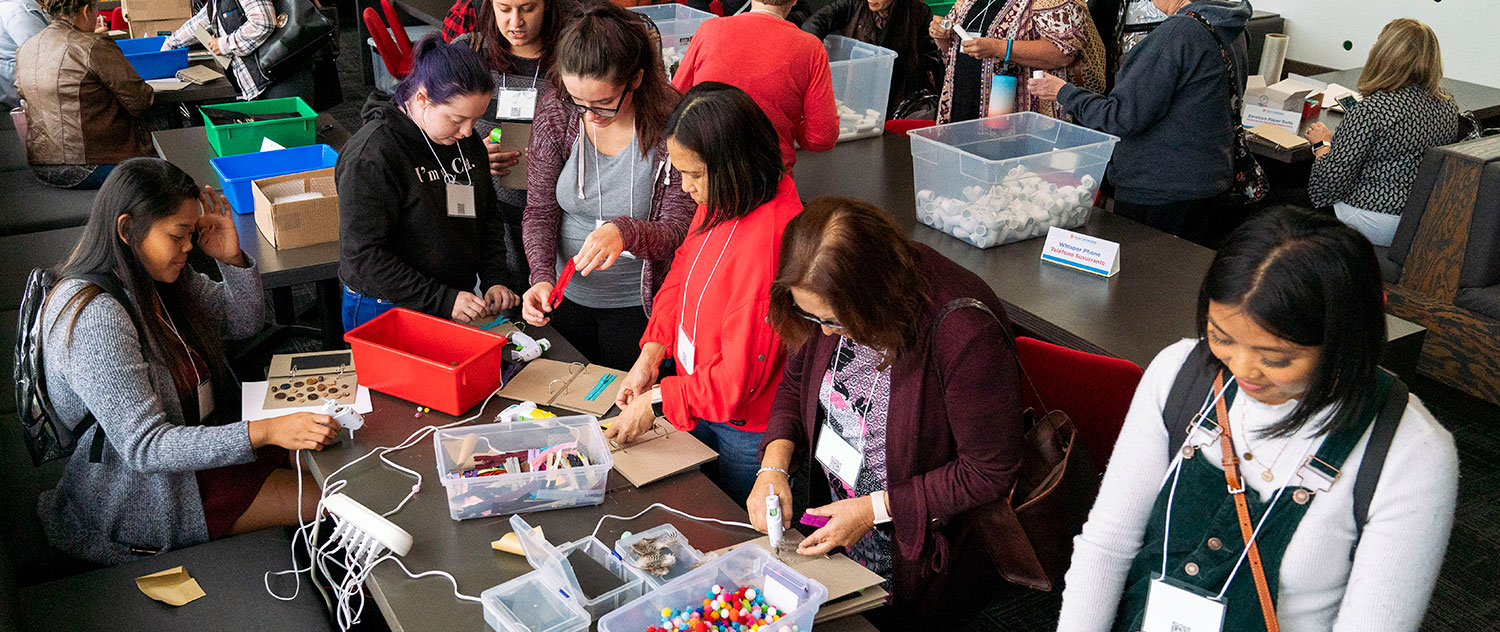 Event attendees doing crafts on a table