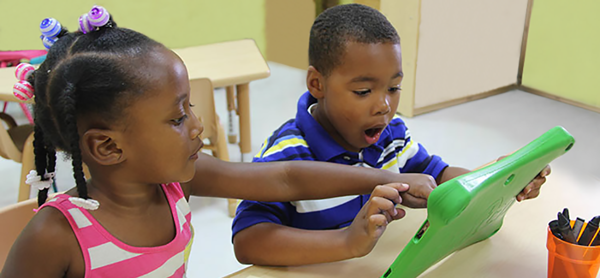 Two Kids Using IPad